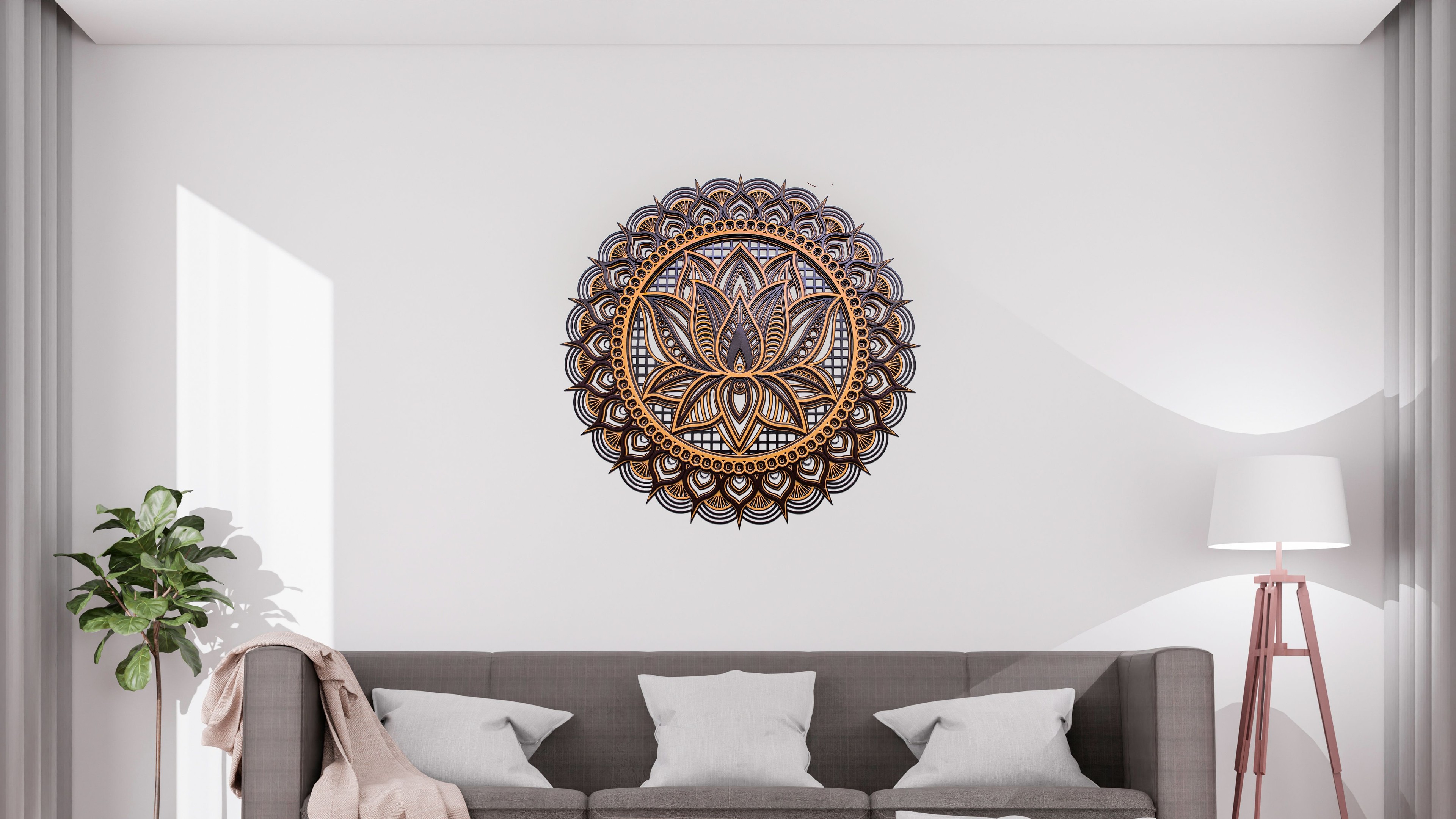 Close-up of brown mandala with bronze lotus design and fine details.